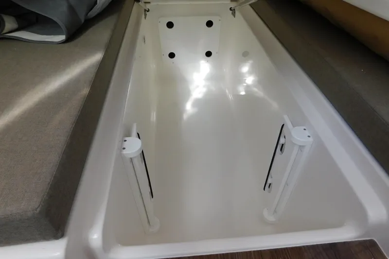 Slide: The Image of 2026 Regulator 35 boat storage compartment with cushioned seating. - 67