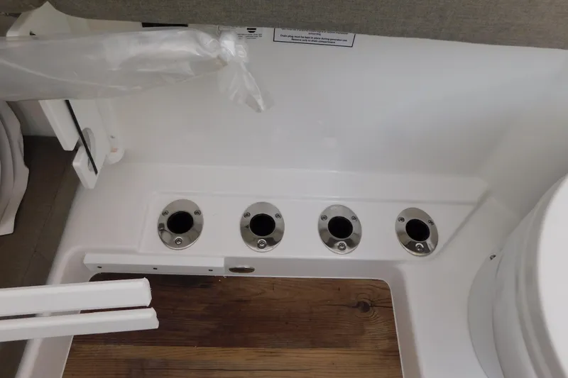 Slide: The Image of Interior view of 2026 Regulator 35 boat with rod holders and wooden flooring. - 69