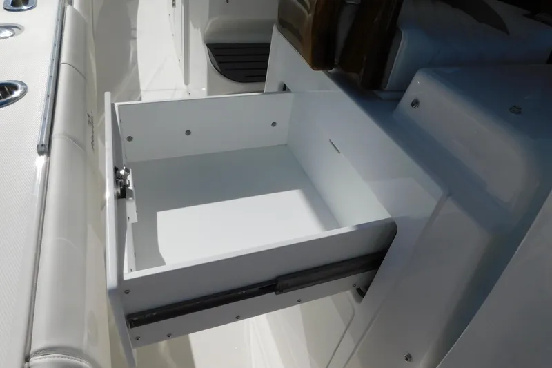 Slide: The Image of Open storage drawer on 2026 Regulator 35 boat, showcasing interior design. - 72