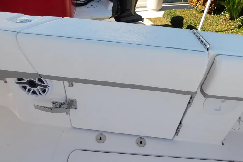 Slide: The Image of 2026 Regulator 35 boat interior with white cushioned seating and speaker. - 73