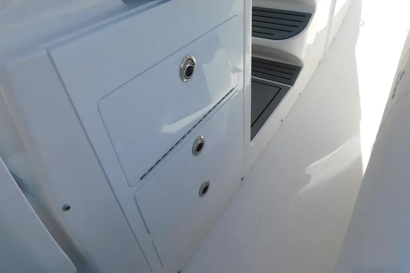 Slide: The Image of 2026 Regulator 35 boat interior with storage compartments and steps. - 76