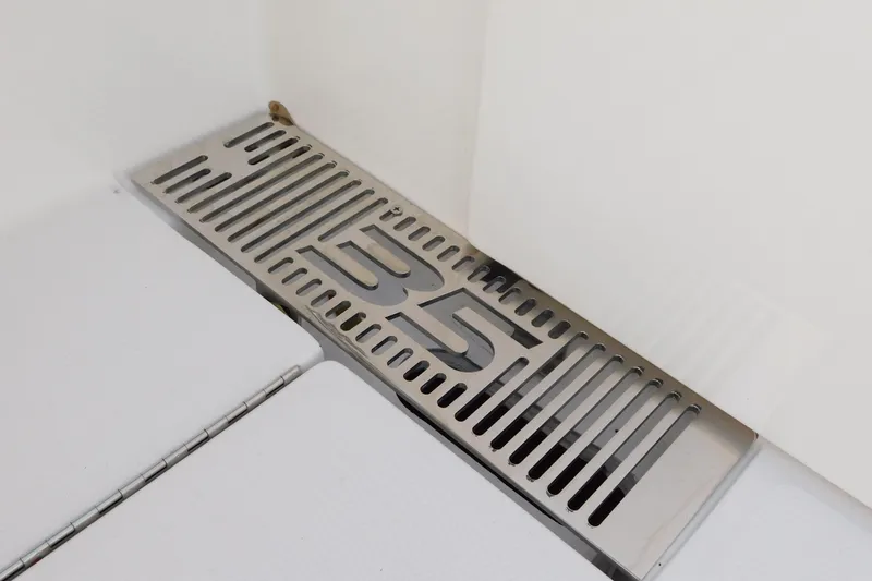 Slide: The Image of Stainless steel vent with "35" design on Regulator 35, 2026 model. - 77