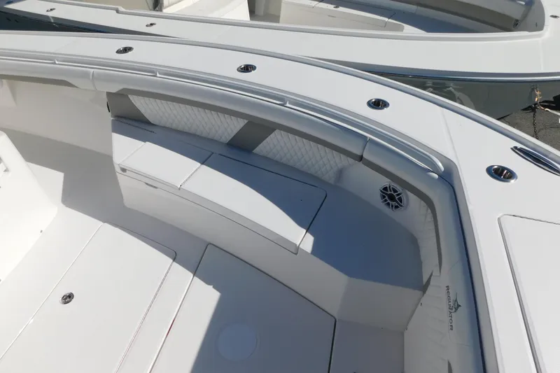 Slide: The Image of 2026 Regulator 35 boat interior with cushioned seating and sleek design. - 78