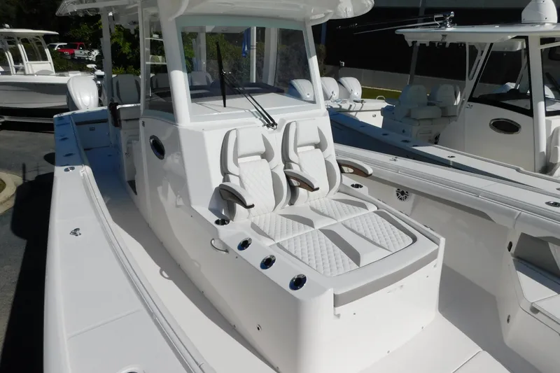 Slide: The Image of 2026 Regulator 35 boat with sleek white seating and modern design. - 82