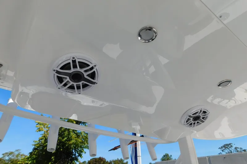 Slide: The Image of 2026 Regulator 35 boat speakers and ceiling detail against a clear blue sky. - 85