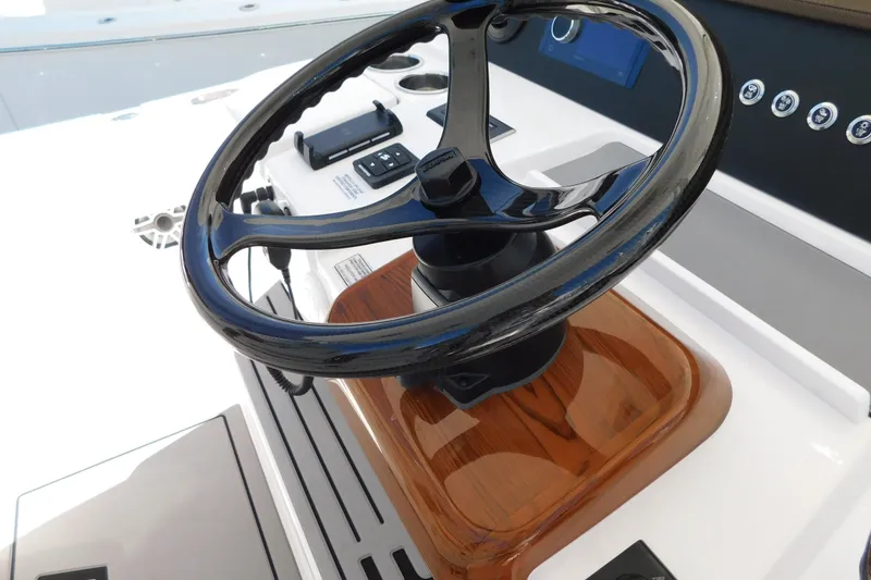 Slide: The Image of Steering wheel of 2026 Regulator 35 boat, featuring sleek design and modern controls. - 87