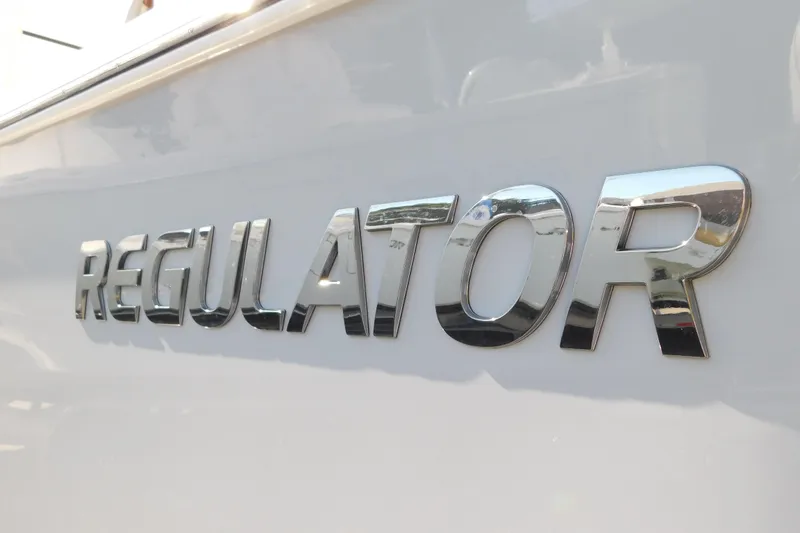 Slide: The Image of Chrome "Regulator" logo on 2026 Regulator 35 boat hull. - 94