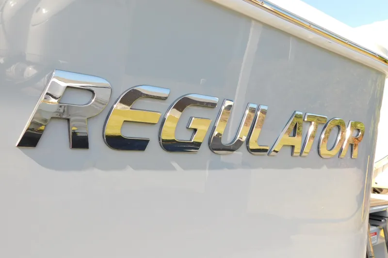 Slide: The Image of Regulator 35 boat logo in shiny chrome, 2026 model. - 95