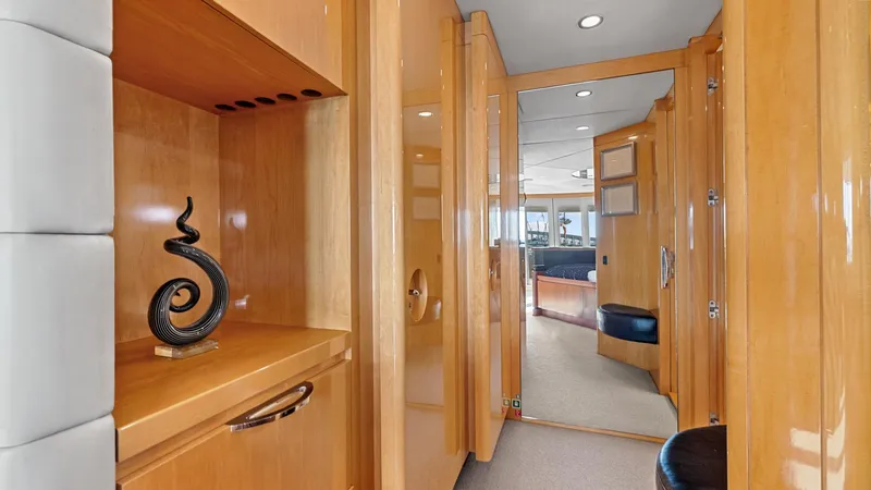 Slide: The Image of Luxurious interior of 2005 New Zealand Yachts Wave Piercer, featuring elegant wood finishes and modern decor. - 31