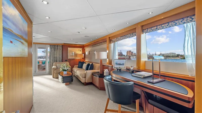 Slide: The Image of Luxurious interior of 2005 New Zealand Yachts Wave Piercer, featuring elegant seating and workspace. - 33