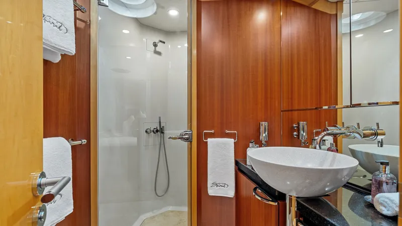 Slide: The Image of Luxurious yacht bathroom with modern fixtures, wooden paneling, and glass shower, New Zealand Yachts Wave Piercer 2005. - 47