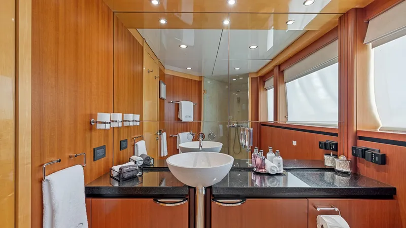 Slide: The Image of Luxurious yacht bathroom with wooden accents, modern fixtures, and large mirror. New Zealand Yachts Wave Piercer 2005. - 35