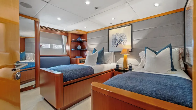 Slide: The Image of Luxurious 2005 New Zealand Yachts Wave Piercer cabin with twin beds and elegant decor. - 39