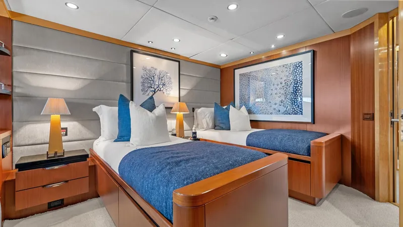 Slide: The Image of Luxurious 2005 New Zealand Yachts Wave Piercer cabin with twin beds and elegant decor. - 40