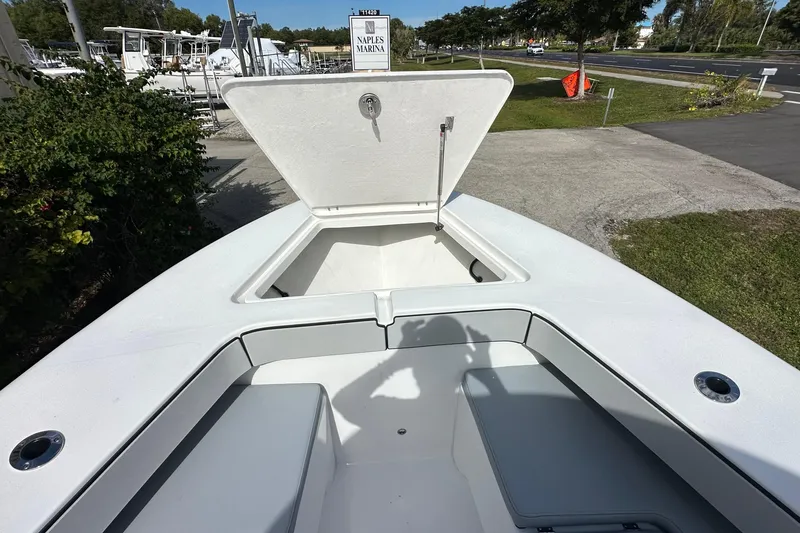 Slide: The Image of 2026 Delta Boatworks Delta D245 with open storage compartment at Naples Marina. - 10