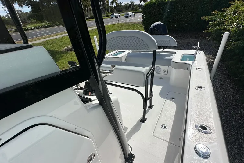 Slide: The Image of 2026 Delta Boatworks Delta D245 interior with seating and fishing rod holders. - 11
