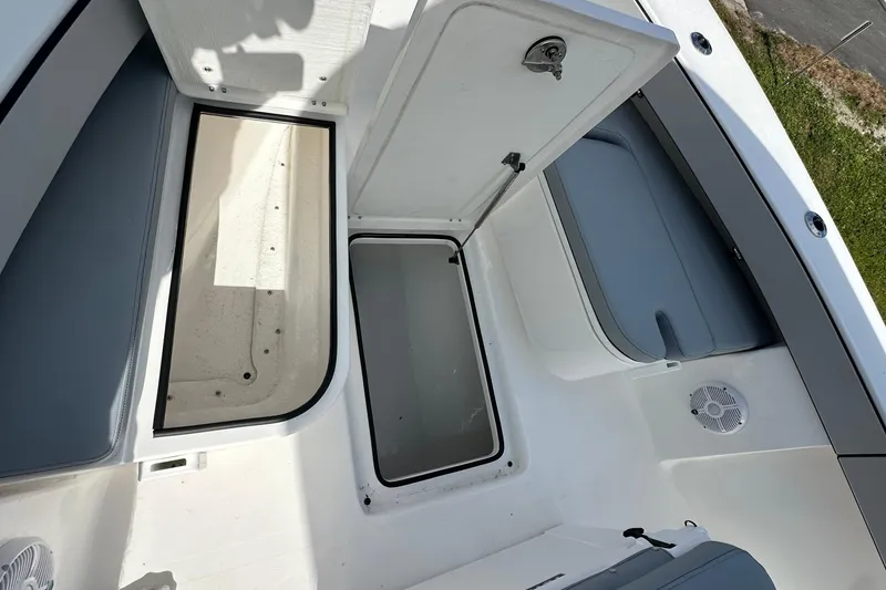 Slide: The Image of Open storage compartments on 2026 Delta Boatworks Delta D245 deck. - 12