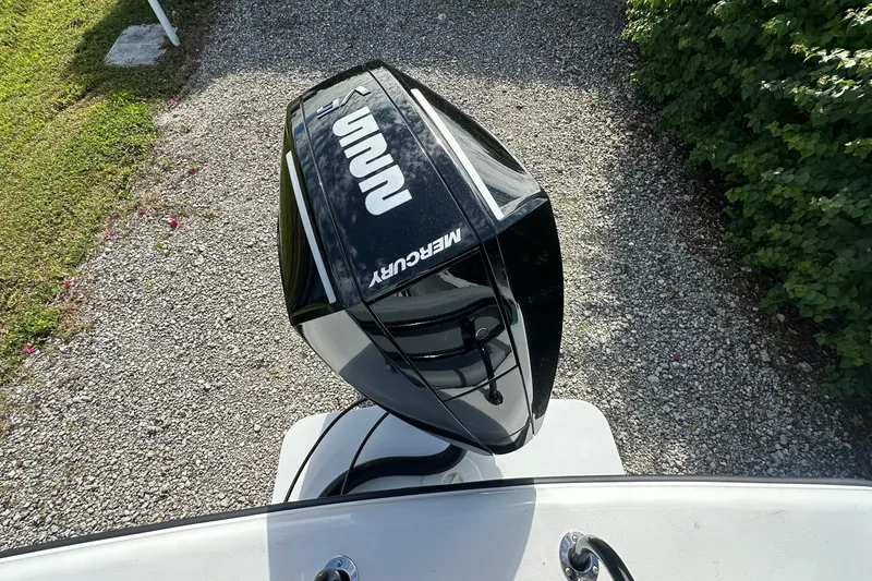 Slide: The Image of Top view of a 2026 Delta D245 boat with a Mercury outboard motor. - 18