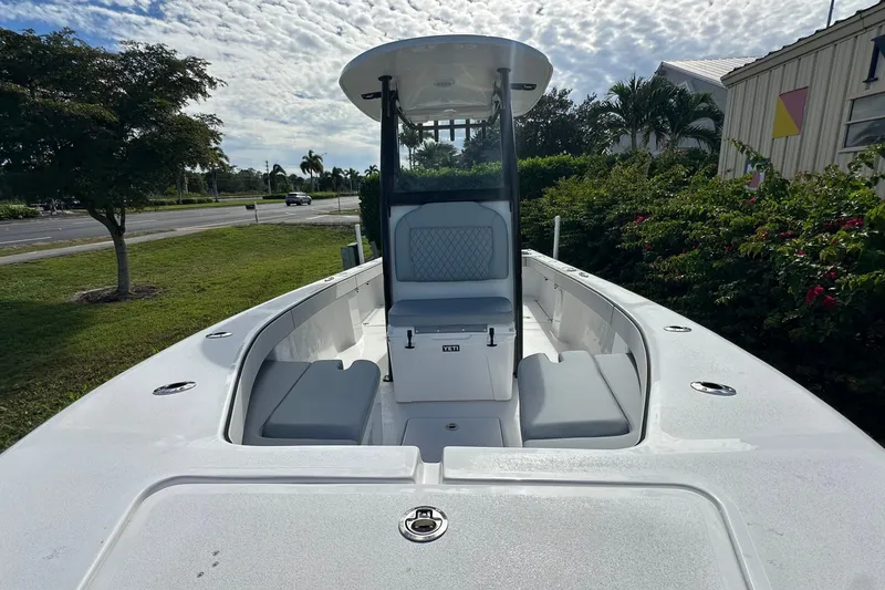 Slide: The Image of 2026 Delta Boatworks Delta D245 with sleek design and spacious seating under a cloudy sky. - 5