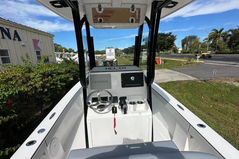 Slide: The Image of 2026 Delta Boatworks Delta D245 helm with Garmin navigation, parked at Naples Marina. - 7