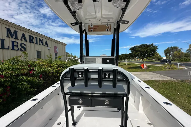 Slide: The Image of 2026 Delta Boatworks Delta D245 at marina, showcasing helm and seating area. - 9