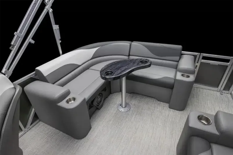 Slide: The Image of Manufacturer Provided Image: 2025 Avalon LSZ ELITE boat interior with gray seating and table. - 2