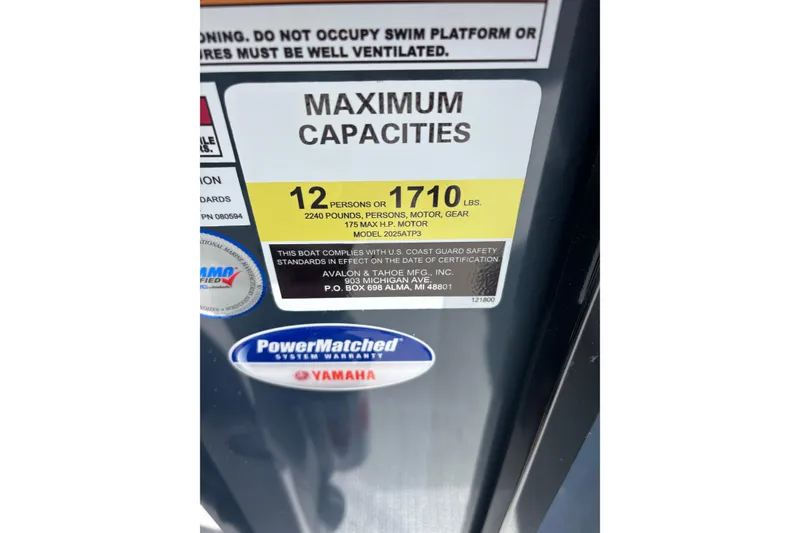 Slide: The Image of 2026 Avalon LSZ ELITE boat capacity label, 12 persons or 1710 lbs, Yamaha warranty. - 6