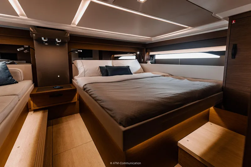 Slide: The Image of Luxurious cabin interior of 2026 Wellcraft 44 Explorer yacht, featuring modern design and cozy bedding. - 11