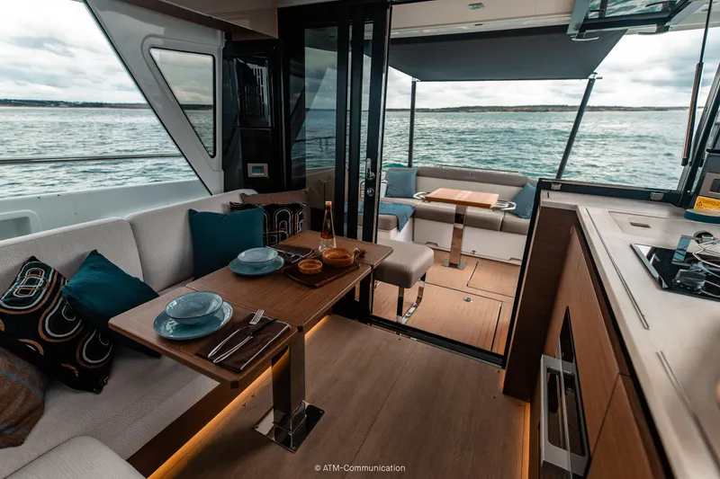 Slide: The Image of Interior of 2026 Wellcraft 44 Explorer yacht with dining area and ocean view. - 13