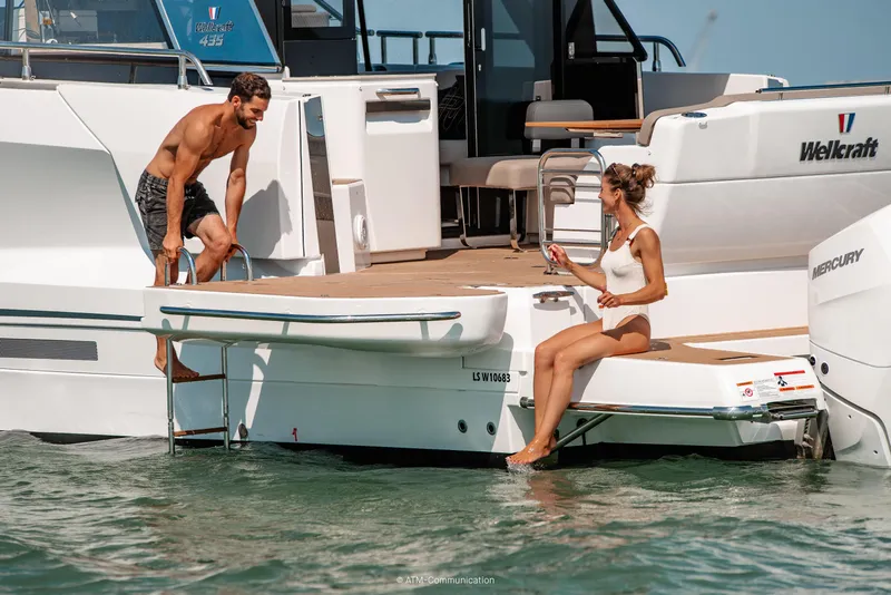 Slide: The Image of Couple enjoying leisure time on 2026 Wellcraft 44 Explorer yacht. - 16