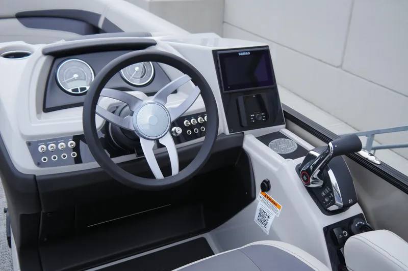 Slide: The Image of 2025 Barletta Cabrio 22UC boat dashboard with steering wheel and control panel. - 10
