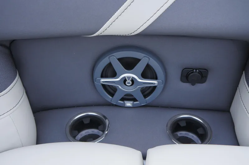 Slide: The Image of 2025 Barletta Cabrio 22UC boat interior with speaker and cup holders. - 12