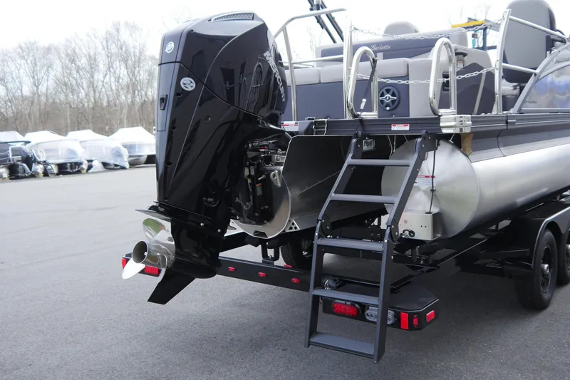 Slide: The Image of 2025 Barletta Cabrio 22UC pontoon boat with powerful outboard motor and rear ladder. - 5