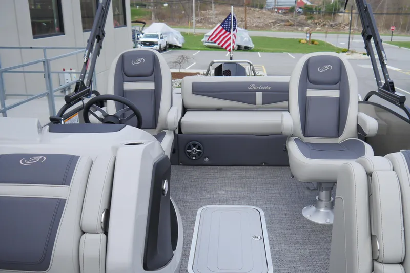 Slide: The Image of 2025 Barletta Cabrio 22UC pontoon boat interior with plush seating and modern design. - 7