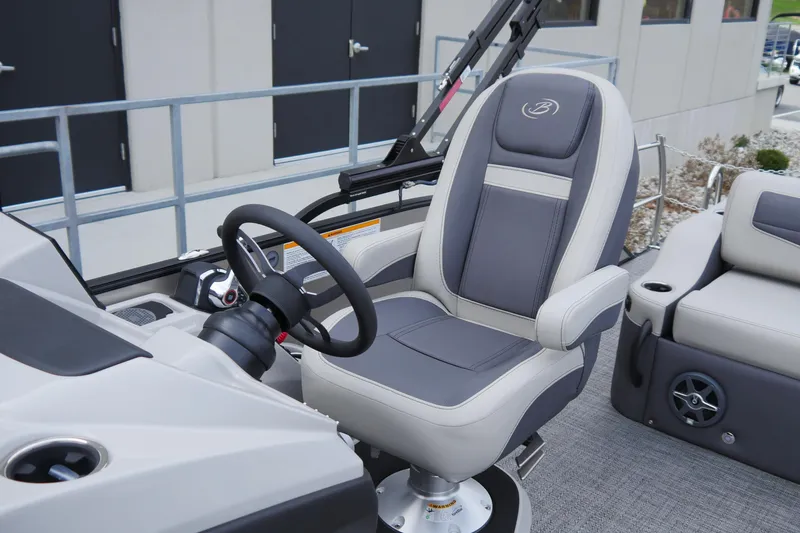Slide: The Image of Captain's chair and helm of 2025 Barletta Cabrio 22UC pontoon boat. - 9