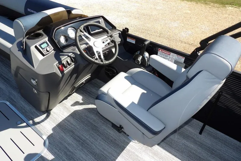 Slide: The Image of 2026 Bennington S Swingback 22 SSB boat interior with steering console and captain's chair. - 16