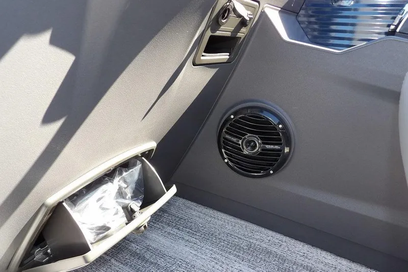 Slide: The Image of 2026 Bennington S Swingback 22 SSB interior speaker and storage compartment detail. - 22
