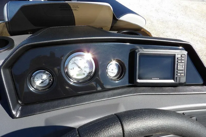 Slide: The Image of Dashboard of 2026 Bennington S Swingback 22 SSB with gauges and Garmin display. - 23