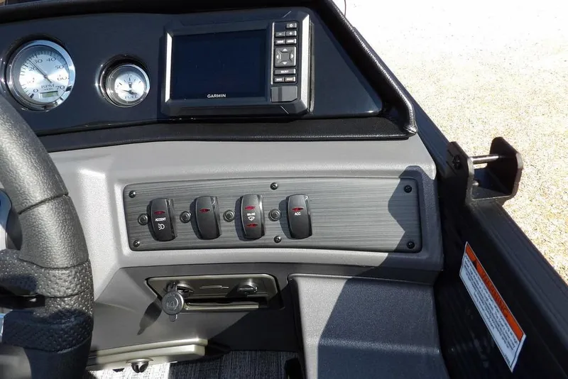 Slide: The Image of Dashboard of 2026 Bennington S Swingback 22 SSB with controls and Garmin display. - 24