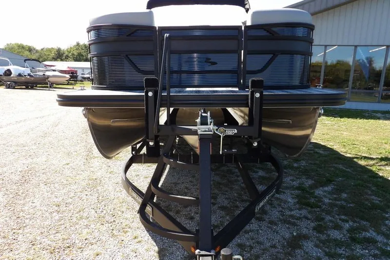 Slide: The Image of 2026 Bennington S Swingback 22 SSB pontoon boat on trailer, outdoor display. - 3