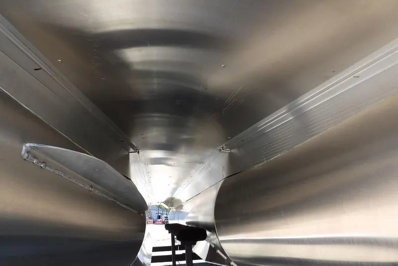 Slide: The Image of Underneath view of 2026 Bennington S Swingback 22 SSB pontoon boat, showcasing sleek aluminum construction. - 39