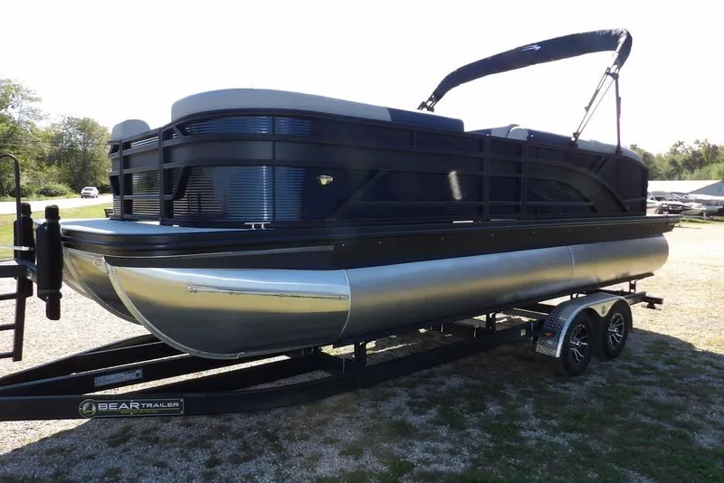 Slide: The Image of 2026 Bennington S Swingback 22 SSB pontoon boat on trailer, side view. - 4