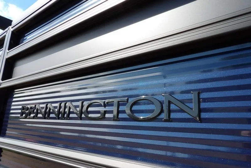 Slide: The Image of 2026 Bennington S Swingback 22 SSB boat with sleek metallic finish and logo. - 42