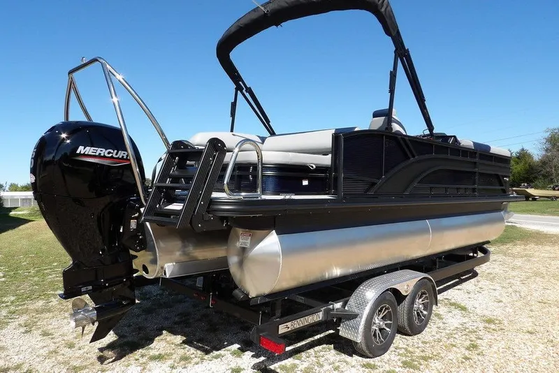 Slide: The Image of 2026 Bennington S Swingback 22 SSB pontoon boat with Mercury engine on trailer. - 9