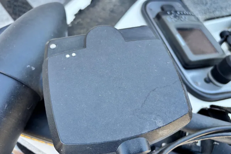 Slide: The Image of Close-up of a 2012 Skeeter TZX190 boat control panel with electronic device. - 2