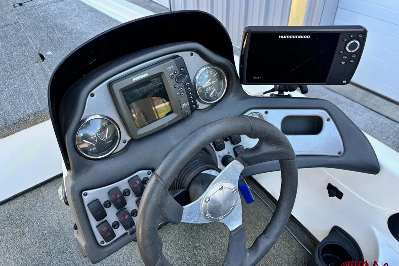 Slide: The Image of 2012 Skeeter TZX190 boat dashboard with steering wheel and Humminbird electronics. - 6