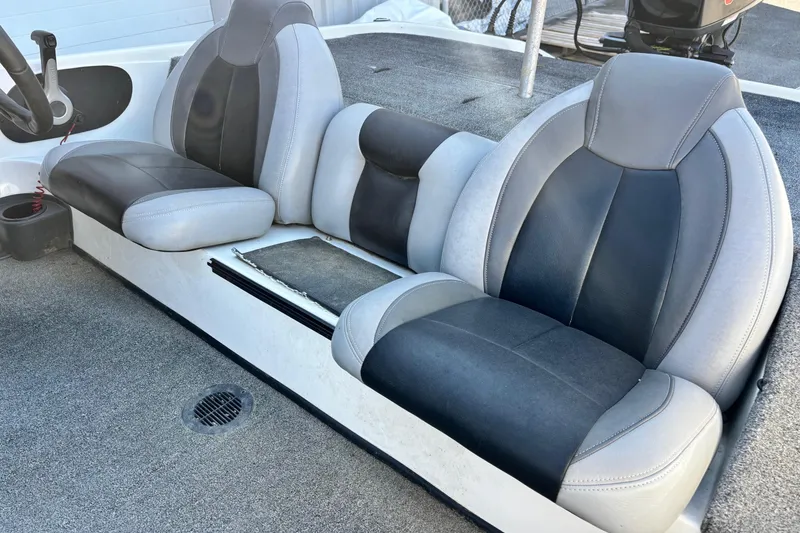 Slide: The Image of 2012 Skeeter TZX190 boat interior with gray and black seating. - 8