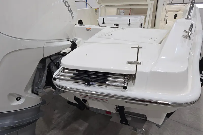 Slide: The Image of 2026 Boston Whaler 220 Dauntless boat with Mercury engine, rear view. - 20