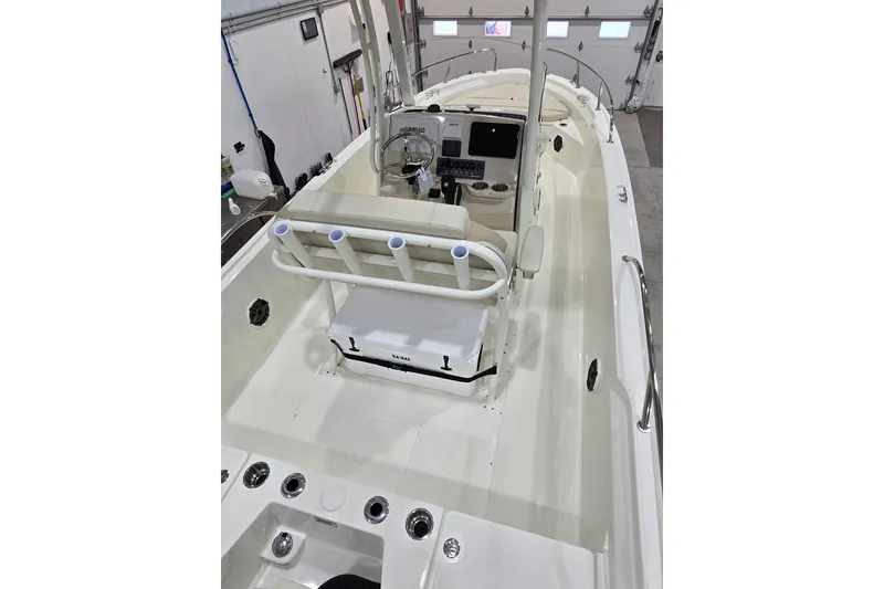 Slide: The Image of 2026 Boston Whaler 220 Dauntless boat interior with helm and seating. - 22