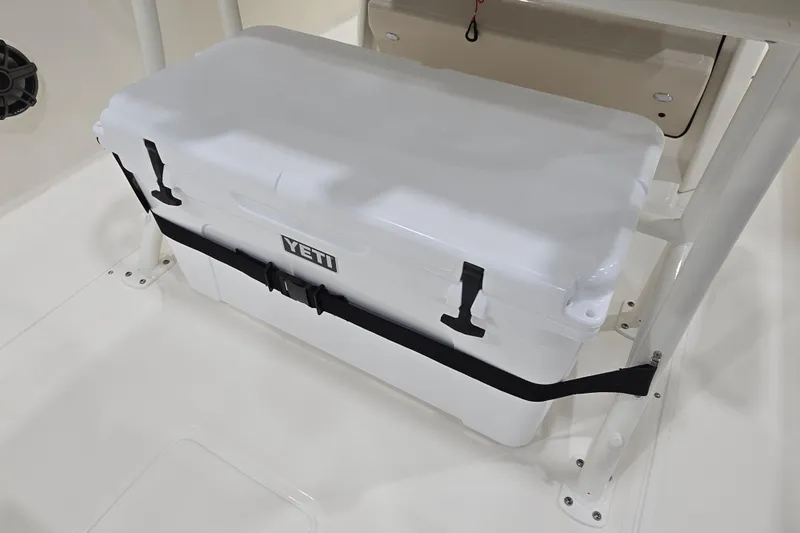 Slide: The Image of YETI cooler secured on 2026 Boston Whaler 220 Dauntless boat deck. - 36